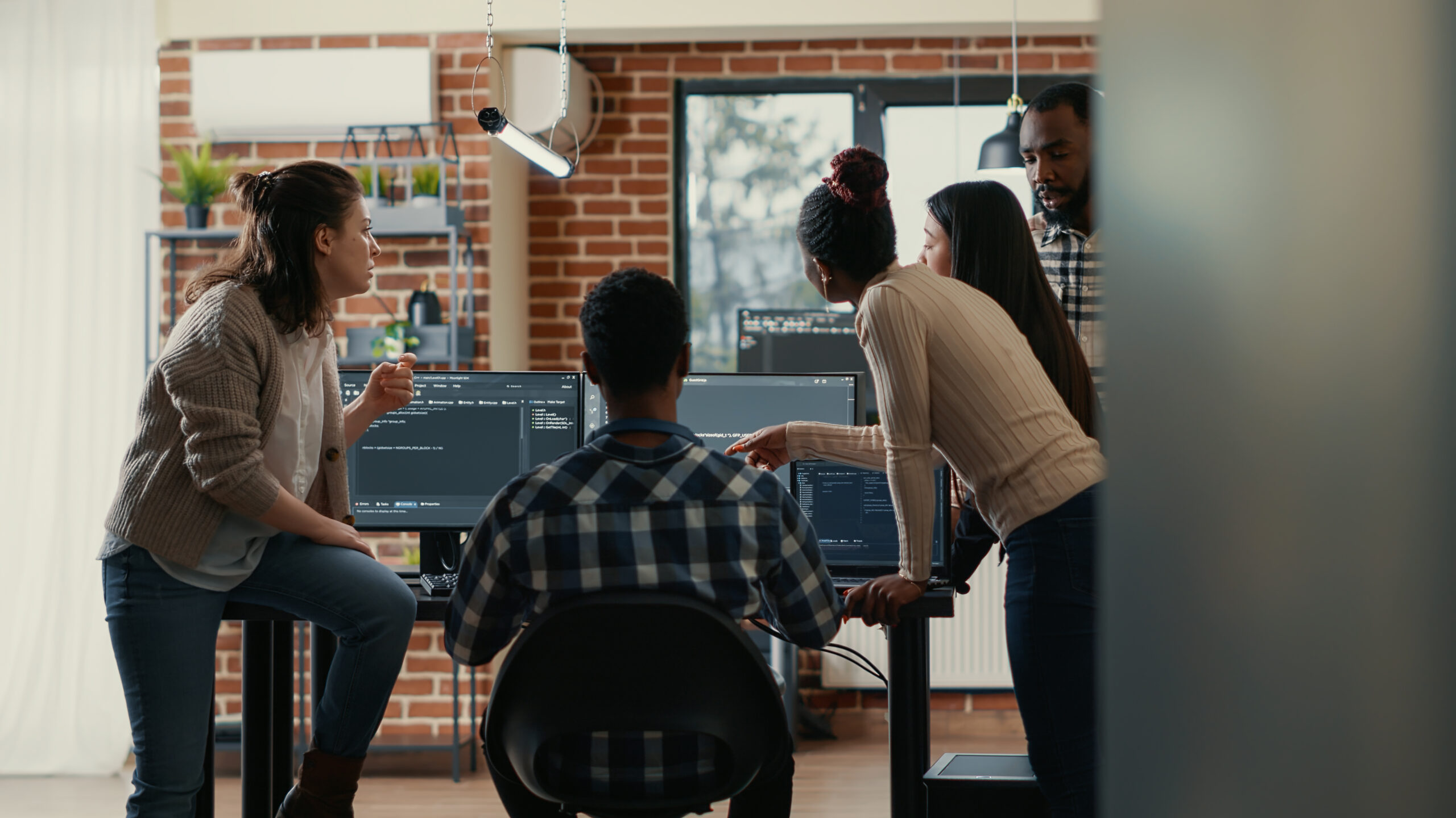 coders discussing about source code compiling discovers errors and asks the rest of the team for explanations
